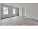 Large bedroom area still under construction featuring multiple windows and ensuite bathroom at 5327 6Th N Ave, St Petersburg, FL 33710