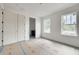 Bright bedroom with two windows and neutral color scheme. Closet with double doors at 5327 6Th N Ave, St Petersburg, FL 33710