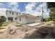 Beautiful white home with a detached garage and accessory building, complemented by the surrounding landscape at 5327 6Th N Ave, St Petersburg, FL 33710