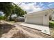 The detached garage is clean and modern with a large concrete driveway at 5327 6Th N Ave, St Petersburg, FL 33710