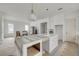 Bright, open-concept kitchen with white cabinets, island and stainless steel appliances at 5327 6Th N Ave, St Petersburg, FL 33710