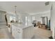 Spacious kitchen with a large island, a farmhouse sink, and stainless steel hardware at 5327 6Th N Ave, St Petersburg, FL 33710