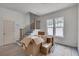 Living room with staircase, black iron railings and natural light from large windows at 5327 6Th N Ave, St Petersburg, FL 33710