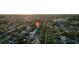 An aerial view showing the neighborhood location surrounded by trees and the morning sun at 6326 22Nd N Ave, St Petersburg, FL 33710