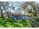 Backyard with Adirondack chairs around a firepit at 7425 118Th Dr, Largo, FL 33773