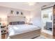 Bedroom featuring a barn door that leads to an ensuite bathroom at 7425 118Th Dr, Largo, FL 33773