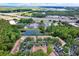 Stunning aerial view showcasing the community nestled among lush greenery, a serene pond, and convenient access to the highway at 8541 Hunters Key Cir, Tampa, FL 33647