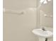 This bathroom features a pedestal sink, a mirrored medicine cabinet, and a convenient towel rack at 8541 Hunters Key Cir, Tampa, FL 33647