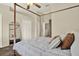 Bright bedroom showcases a four poster bed, a ceiling fan, and ample closet space at 8541 Hunters Key Cir, Tampa, FL 33647
