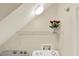 Functional laundry area equipped with shelving above the washer and dryer for storage solutions at 8541 Hunters Key Cir, Tampa, FL 33647