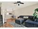 Open concept living room featuring wood flooring, comfortable seating, and view to dining area at 8541 Hunters Key Cir, Tampa, FL 33647