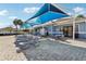 Relaxing community pool deck with comfortable lounge chairs and shaded seating areas at 12018 Gillingham Harbor Ln, Gibsonton, FL 33534