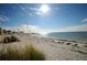 Scenic beach view featuring clear skies, calm ocean waters and soft white sand at 54 Central Ct, Tarpon Springs, FL 34689