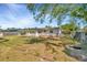 Spacious backyard featuring a pergola and a chain-link fence for added privacy and security at 540 Florida S Cir, Apollo Beach, FL 33572