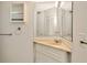 Bathroom featuring a vanity with a marble countertop, a mirror, and tiled walls at 540 Florida S Cir, Apollo Beach, FL 33572