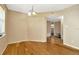 Open dining area with hardwood floors, chandelier, and connection to other rooms at 540 Florida S Cir, Apollo Beach, FL 33572