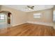 Bright living room with hardwood floors, an archway and ample natural light at 540 Florida S Cir, Apollo Beach, FL 33572