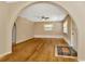 Spacious living area with hardwood floors, arched doorways and ample sunlight at 540 Florida S Cir, Apollo Beach, FL 33572