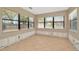 Sun room featuring tile flooring and large windows offering lots of natural light at 540 Florida S Cir, Apollo Beach, FL 33572