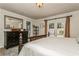 A bedroom with a dark wood dresser, tile floor, and door leading to the exterior at 126 Alora Ne St, St Petersburg, FL 33704