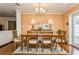 Elegant dining room featuring hardwood floors, chandelier lighting, and a classic wooden dining set at 126 Alora Ne St, St Petersburg, FL 33704