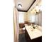 Bathroom features a vanity with sink, shower with curtain, and window at 14124 Plum Ln, Hudson, FL 34667