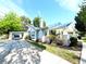Lovely home featuring a well-maintained lawn, carport, and manicured landscaping at 14124 Plum Ln, Hudson, FL 34667