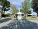 Charming home with a well-maintained fenced yard, mature trees, and curb appeal at 14124 Plum Ln, Hudson, FL 34667