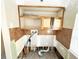Laundry area with upper cabinets and tile backsplash awaiting renovations at 14124 Plum Ln, Hudson, FL 34667