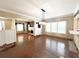 Bright living room with hardwood floors, a fireplace, and ample natural light from the large windows at 14124 Plum Ln, Hudson, FL 34667