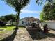 Spacious yard featuring a deck with a gazebo, perfect for outdoor gatherings and relaxation at 14124 Plum Ln, Hudson, FL 34667