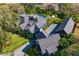 Aerial view of a beautiful home, lush landscaping, and refreshing pool at 3005 S Miller Rd, Valrico, FL 33596