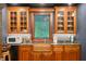 This bar and entertainment area offers an ornate sink, high-end appliances, and plenty of cabinet space at 3005 S Miller Rd, Valrico, FL 33596