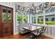 Cozy breakfast nook with blue and white patterned decor, natural light, and wood door at 3005 S Miller Rd, Valrico, FL 33596