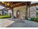 A stone facade, wood timbers, and professional landscaping create an amazing first impression for this home at 3005 S Miller Rd, Valrico, FL 33596
