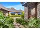 The front yard of this home features professional landscaping, a stone walkway, and a stone facade at 3005 S Miller Rd, Valrico, FL 33596