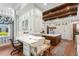 Gourmet kitchen with custom white cabinetry, marble countertops, and professional-grade appliances at 3005 S Miller Rd, Valrico, FL 33596