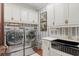This laundry room features modern appliances, plentiful storage, and bright décor for a functional space at 3005 S Miller Rd, Valrico, FL 33596