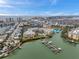 Beautiful aerial view of waterfront condos with docks and a pool, near the ocean and city at 399 150Th Ave # 101, Madeira Beach, FL 33708