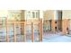 A kitchen under construction featuring white cabinetry, framing, and archways at 4812 Jasper Dr Dr # 101, New Port Richey, FL 34652