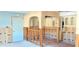 A kitchen under construction featuring white cabinetry, framing, and archways at 4812 Jasper Dr Dr # 101, New Port Richey, FL 34652