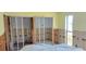 A room under construction featuring framing and a large window at 4812 Jasper Dr Dr # 101, New Port Richey, FL 34652