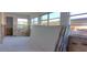 An empty room under construction featuring multiple windows providing natural light at 4812 Jasper Dr Dr # 101, New Port Richey, FL 34652