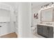 Bathroom near closet features modern vanity, toilet, and glass-enclosed shower with contemporary fixtures and finishes at 531 Danube Ave, Tampa, FL 33606