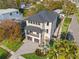 Exterior view features a manicured lawn, mature palm trees, driveway, and two car garage at 531 Danube Ave, Tampa, FL 33606
