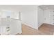 Upstairs hallway with hardwood flooring and ample natural light at 531 Danube Ave, Tampa, FL 33606