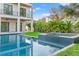 The backyard offers a refreshing pool, spa, and lush landscaping, creating a private oasis at 531 Danube Ave, Tampa, FL 33606