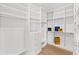 Spacious walk-in closet with custom white shelving and drawers, offering ample storage at 531 Danube Ave, Tampa, FL 33606