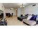 View of the living room, dining area with table and seating for four people at 5396 Gulf Blvd # 110, St Pete Beach, FL 33706