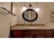 Bathroom vanity with granite counter, decorative lighting, and oval mirror at 6400 46Th N Ave # 307, Kenneth City, FL 33709